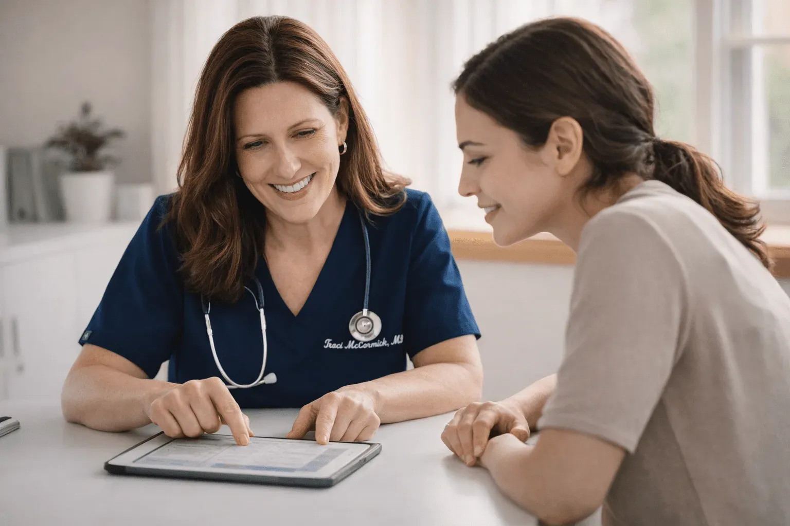 A provider reviewing lab results with a patient
